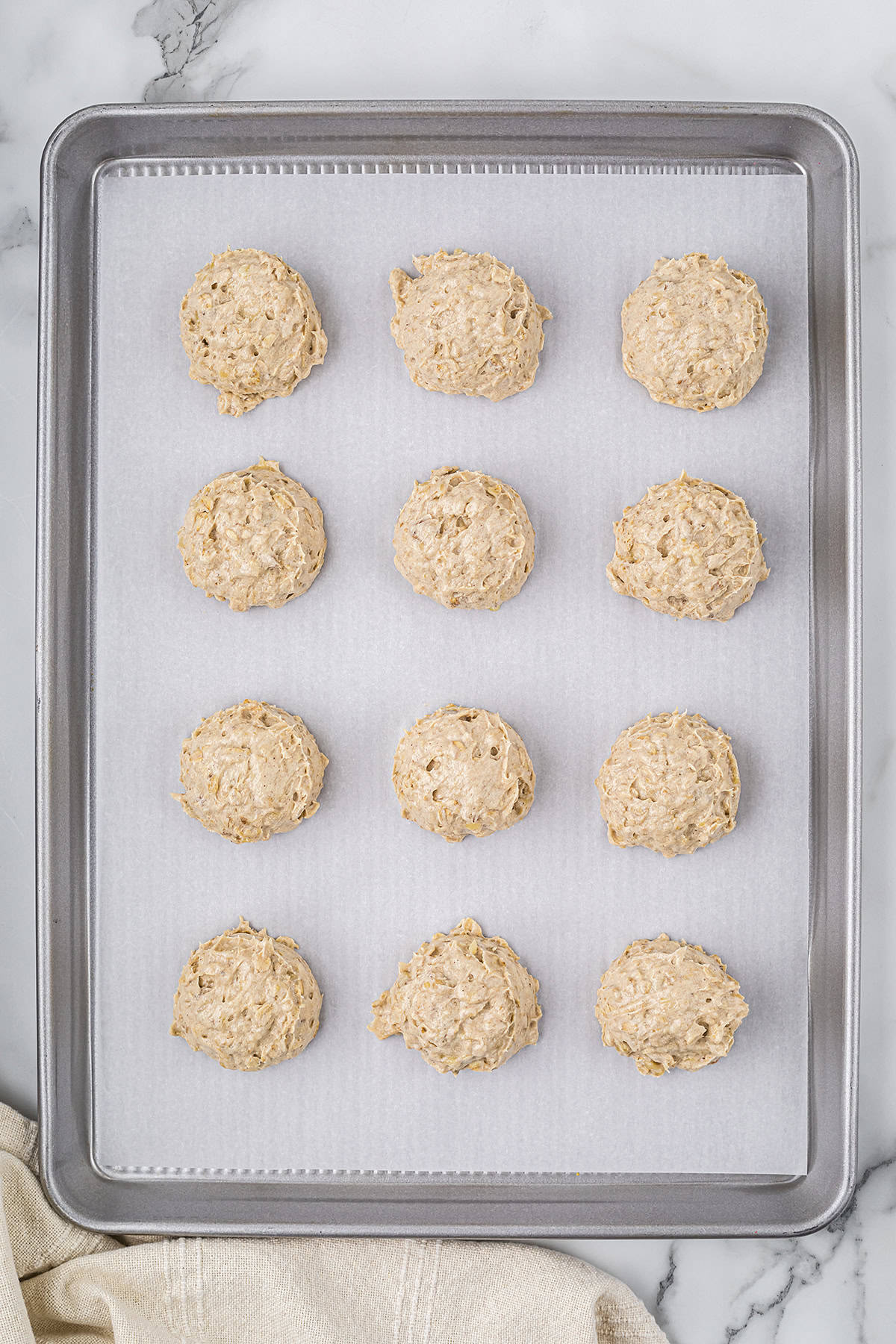 Banana cookie dough on cookie sheet.