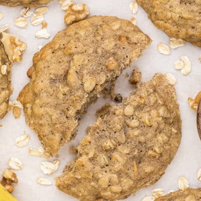 Banana bread cookie broken in half on counter.