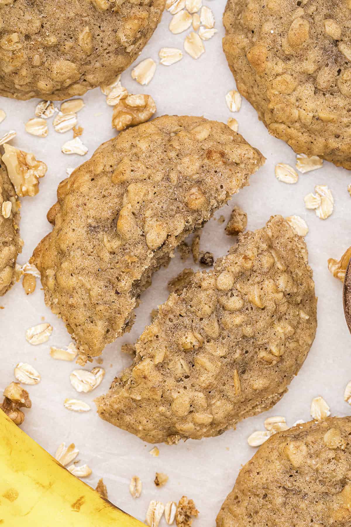 Banana bread cookie broken in half on counter.