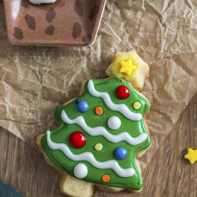 Butter cookie cut out and decorated as a Christmas tree.