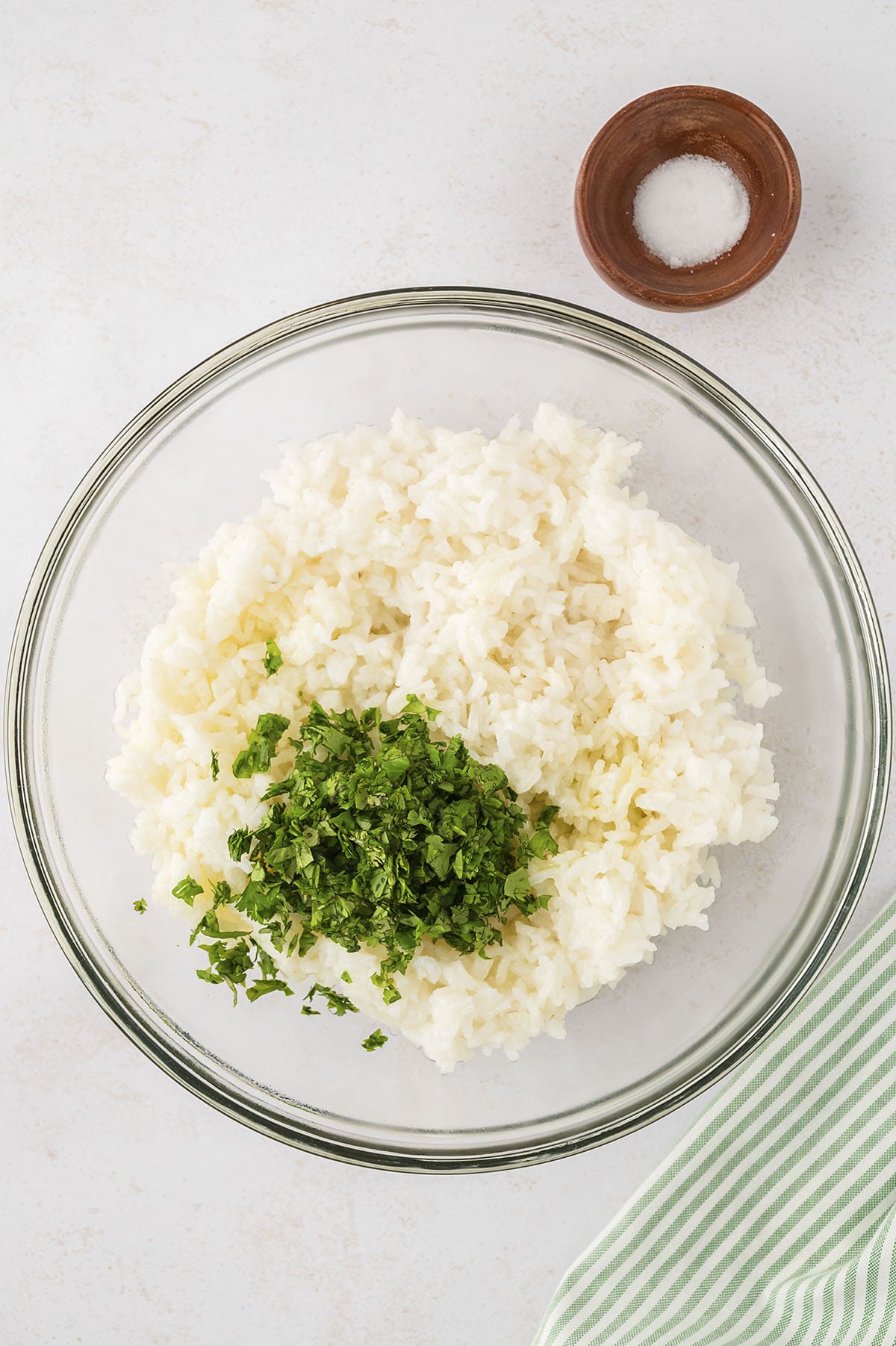 Ingredients for cilantro lime rice in mixing bowl.