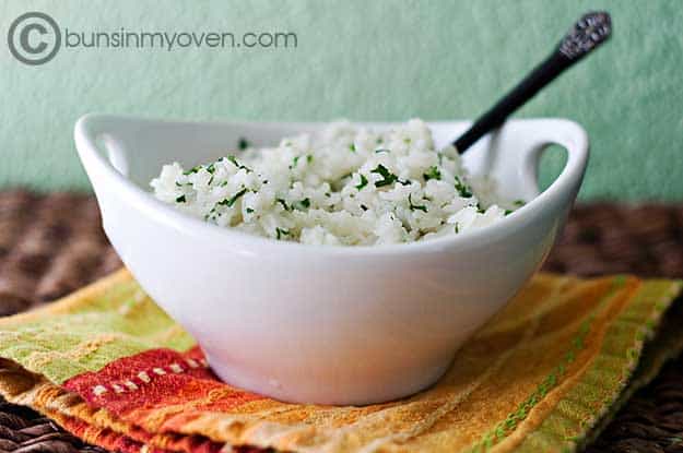 Lime rice in a white bowl with handles