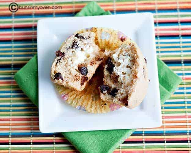 An overhead view of a split open chocolate chip muffin.