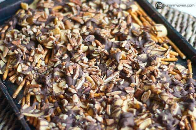 The closeup of chips and pretzels covered in melted chocolate 