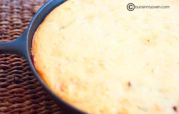 An overhead view of Mexican corn bread in a cast iron skillet 