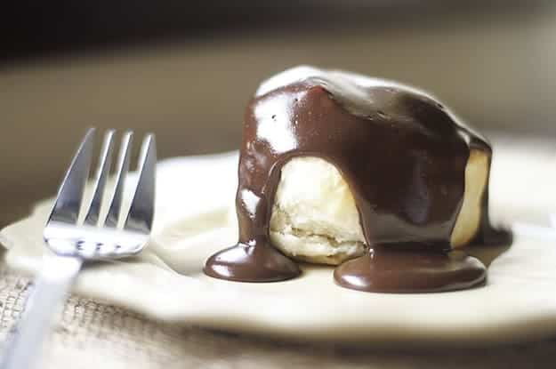 A close up of a biscuit topped with chocolate gravy.