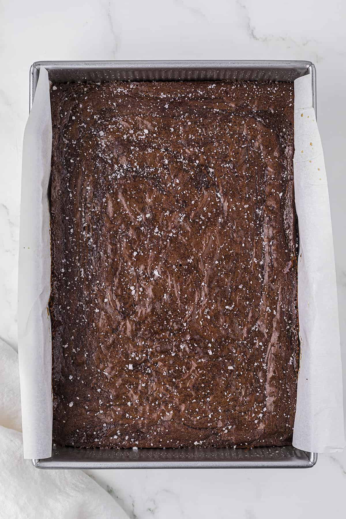 Baked brownies with fleur de sel sprinkled over the top.