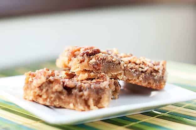 Two shortbread squares on a square plate