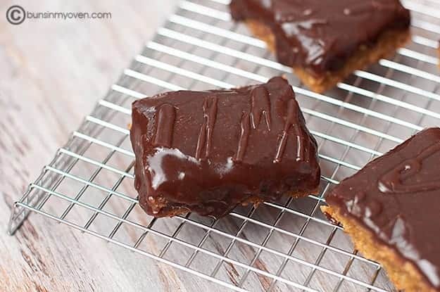 Chocolate frosted peanut butter bar recipe. Bars cooling on counter.