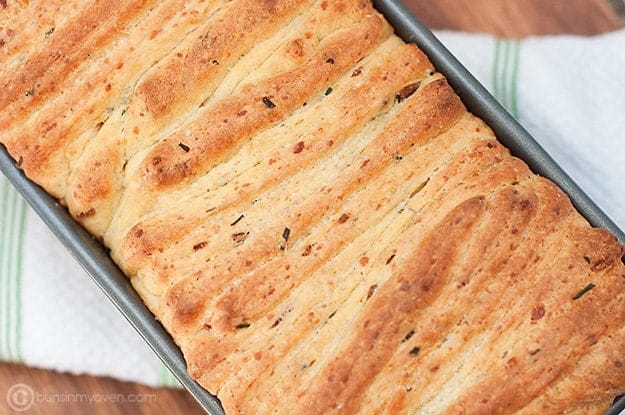 Overhead view of pull-apart bread in a bread pan.
