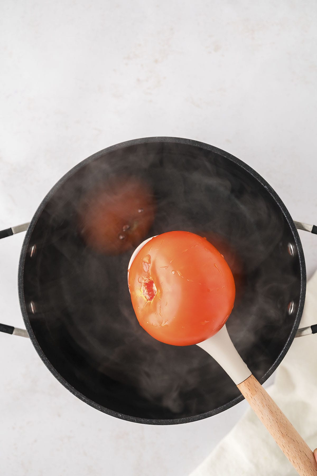 Tomato in boiling water.