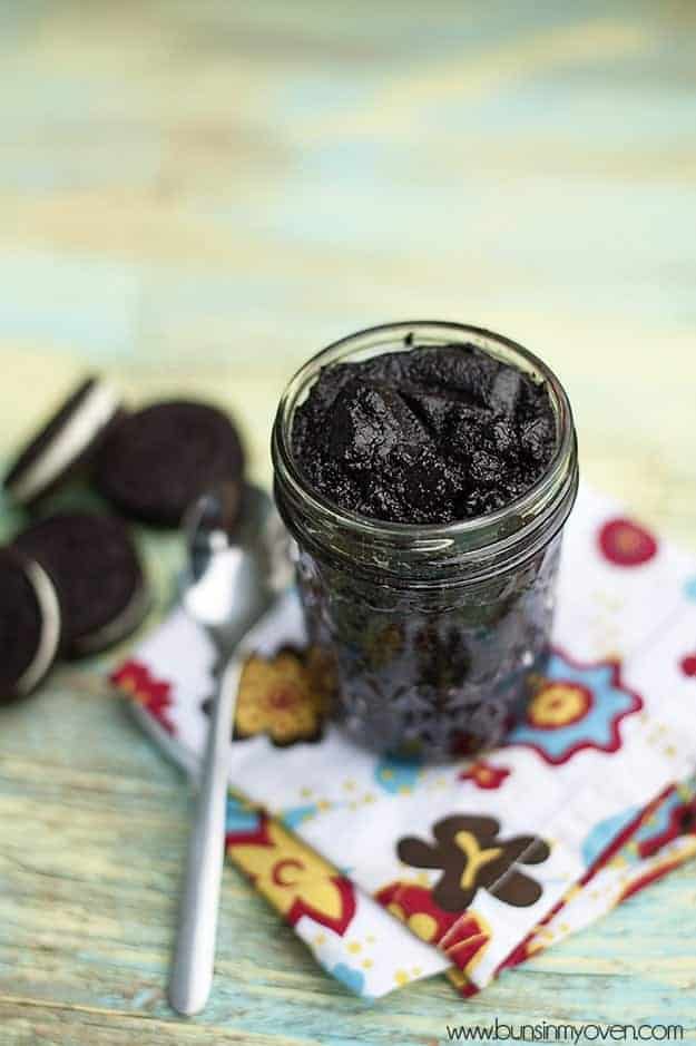 A clear glass jar of oreo cookie spread