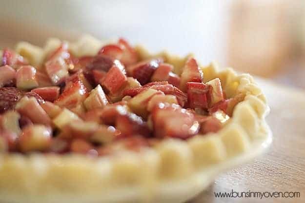 A closeup of strawberries in a pie crust 