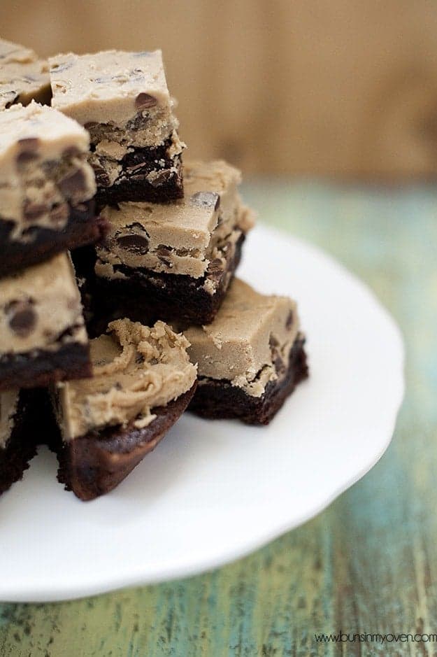 Cookie dough brownies piled up on top of the cake stand 