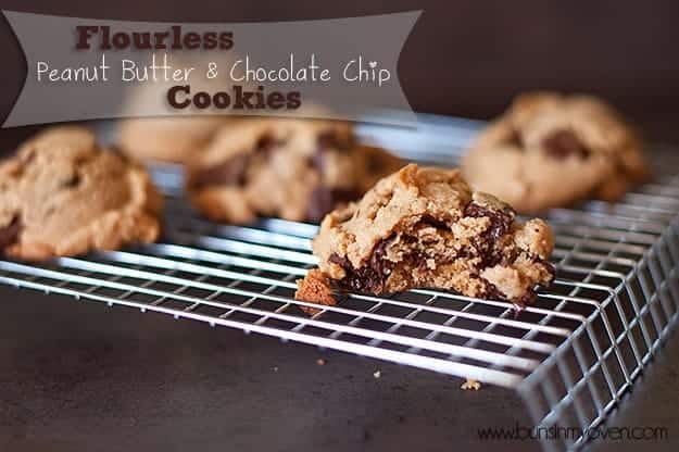 The chocolate chip peanut butter cookie with a bite taken out of it sitting on a wire cooling rack 