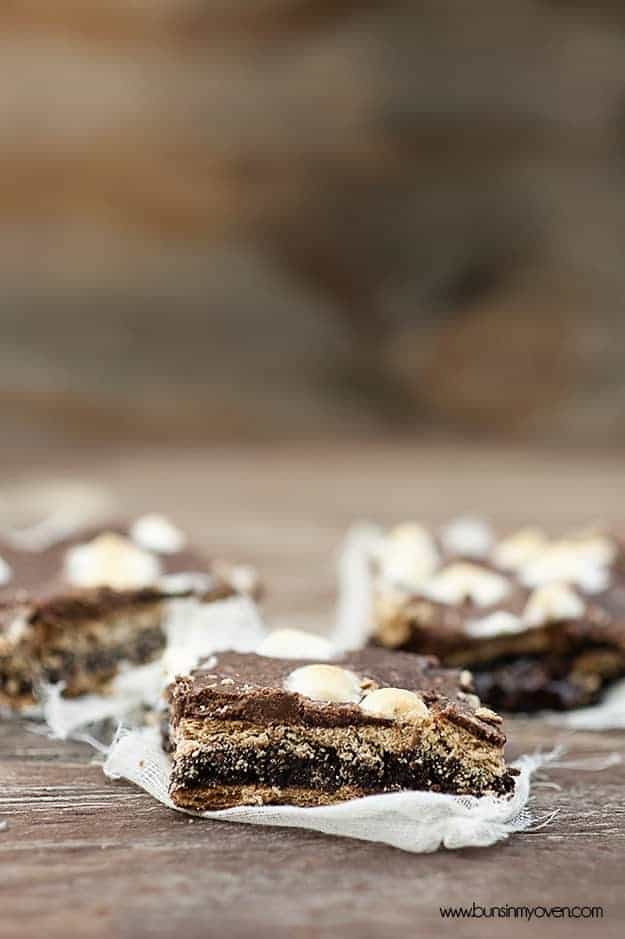 A side view of three smores brownies on a table 