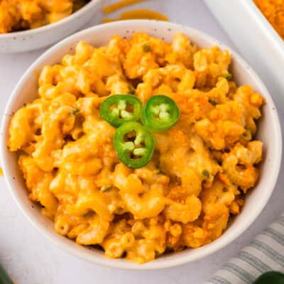 Mac and cheese with jalapenos in small white dish.