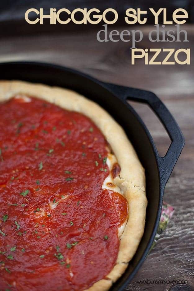 A close up of a cast-iron skillet with a pizza in it.