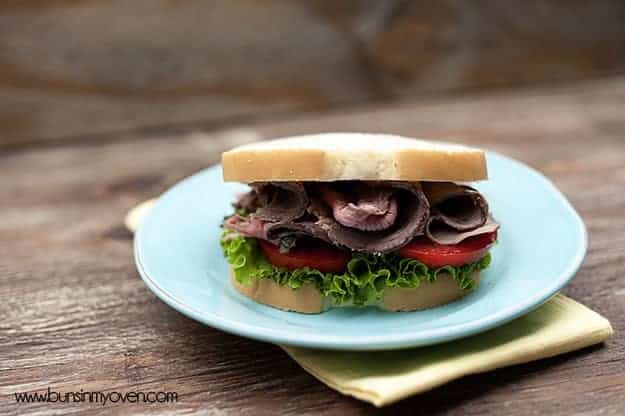 The roast beef sandwich on a white plate 