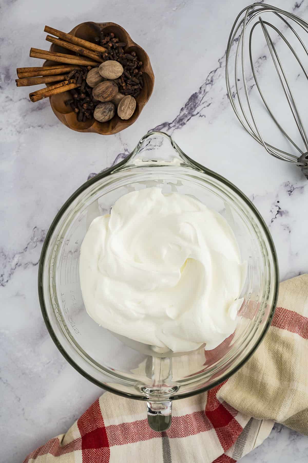 Whipped cream in mixing bowl.