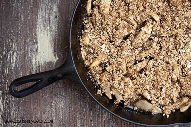 Overhead view of apple crisp in a cast iron skillet