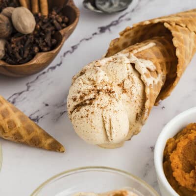 Pumpkin ice cream in a cone.