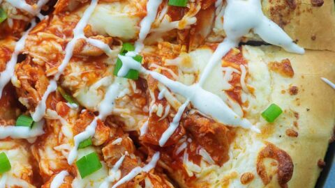 overhead view of sliced buffalo chicken pizza.