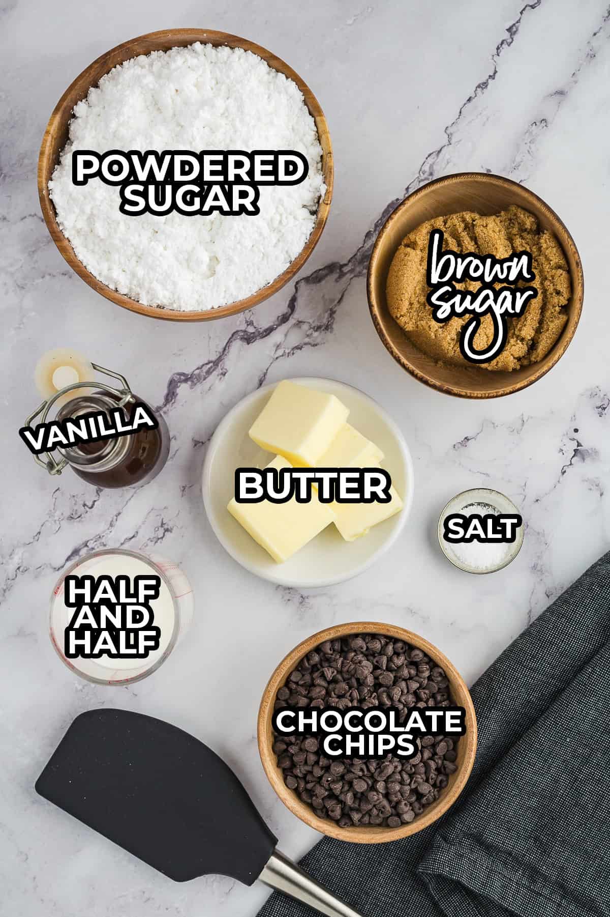 Ingredients for cookie dough fudge on counter in small bowls.