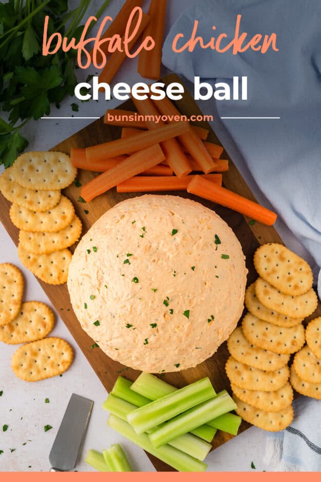 Buffalo chicken cheese ball on wooden board.