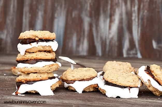 Several smores sandwich cookies on a table.
