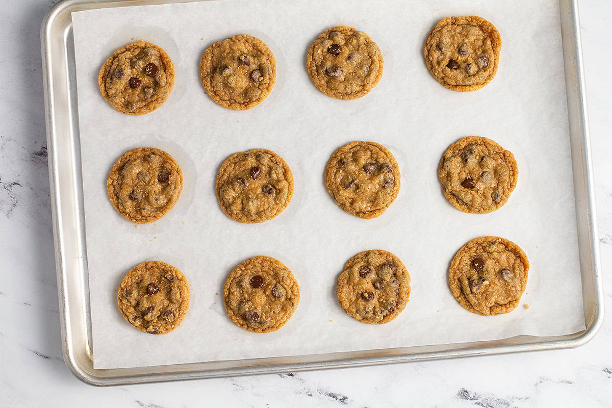 Baked graham cracker cookies on cookie sheet.