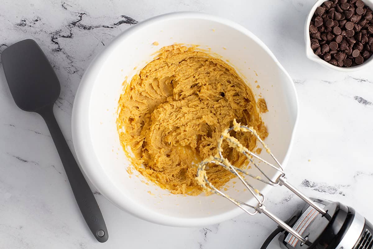 Butter and sugar creamed together in bowl.