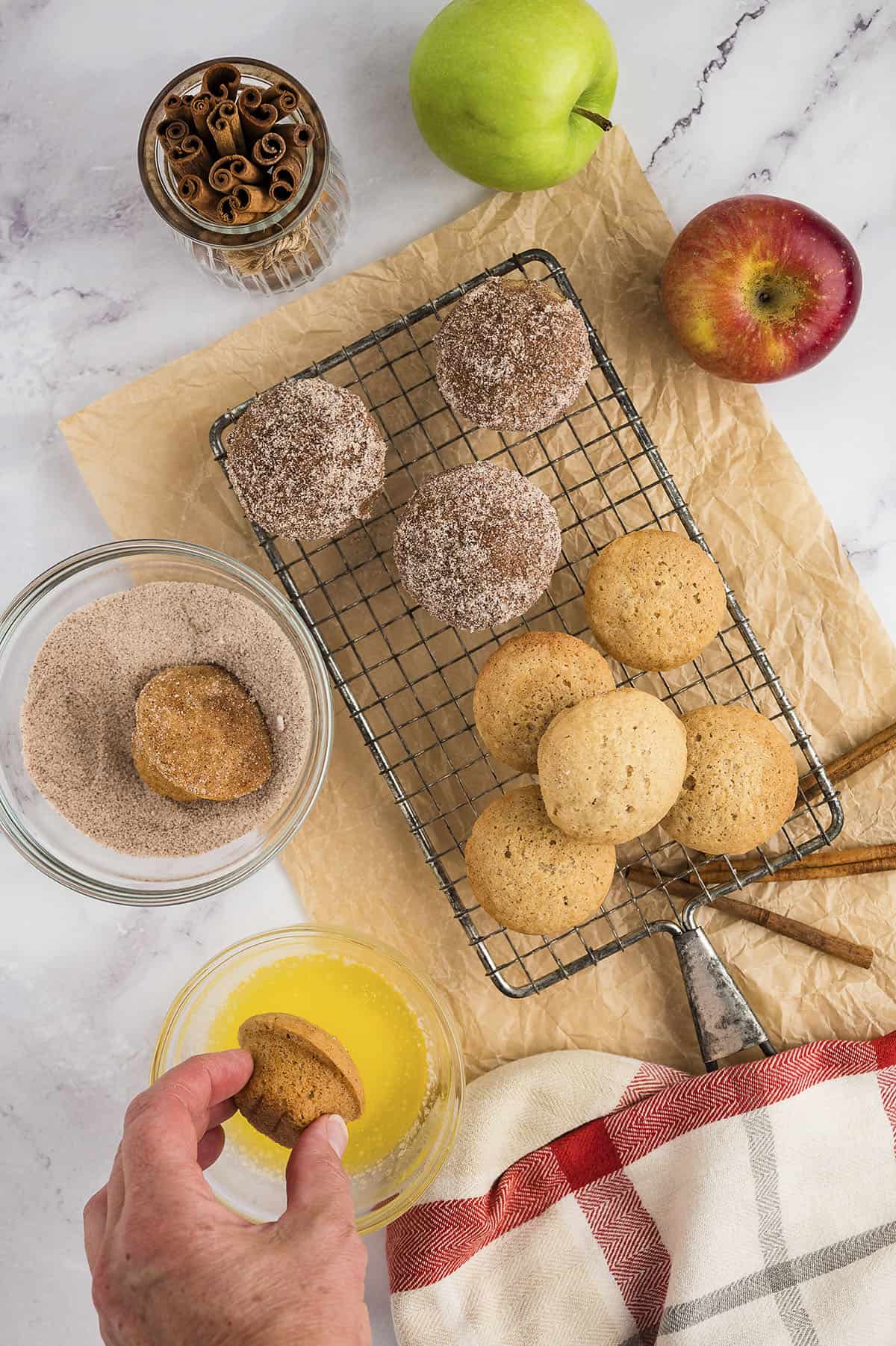 Mini muffins dunked in butter and sugar.