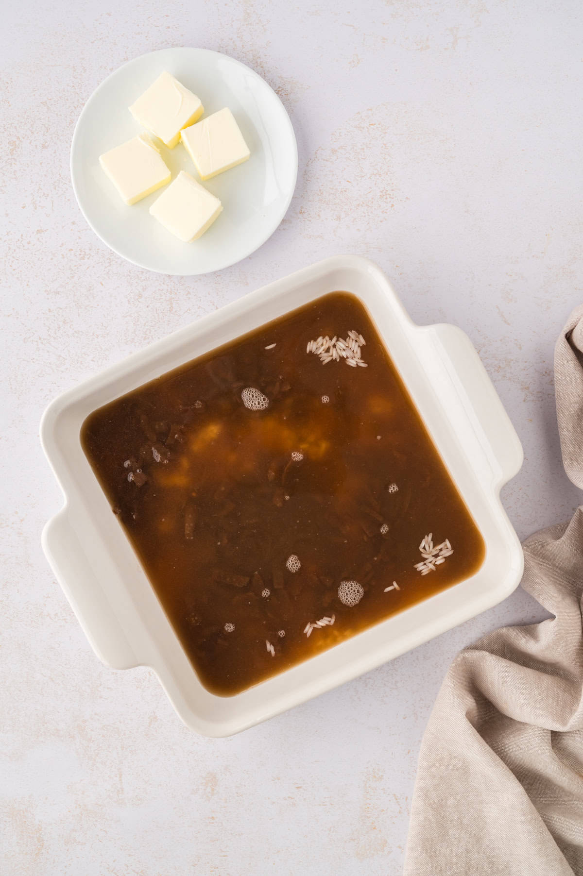 Rice and soup in baking dish.