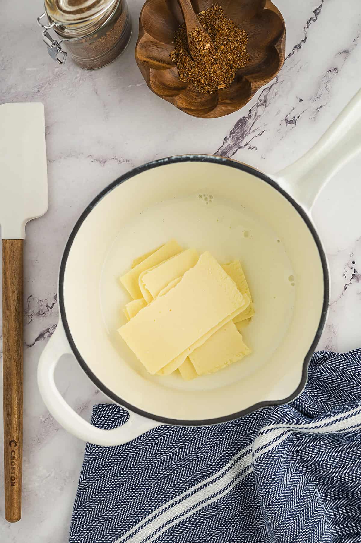 Cheese and milk in pot.