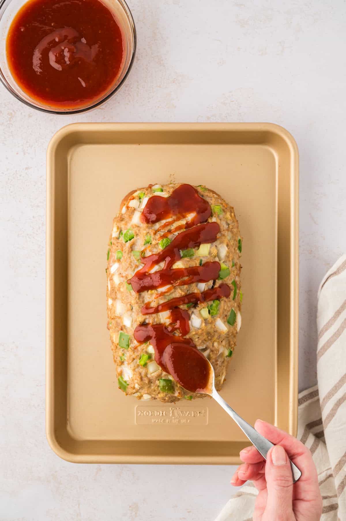 Sauce drizzled on meatloaf.