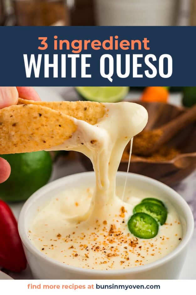 White queso dripping off crispy tortilla chip.