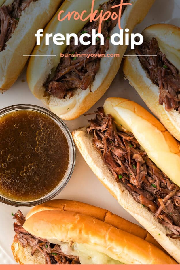 French dip sandwiches on baking sheet.