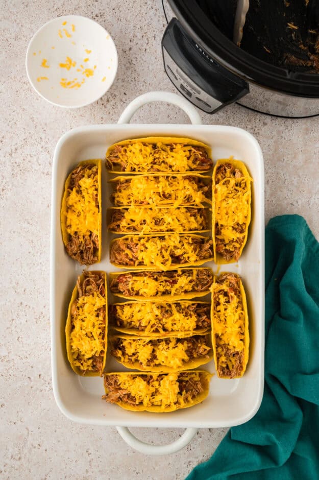 Cheese and chicken in taco shells.