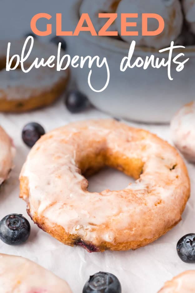 Blueberry donut recipe on parchment paper.