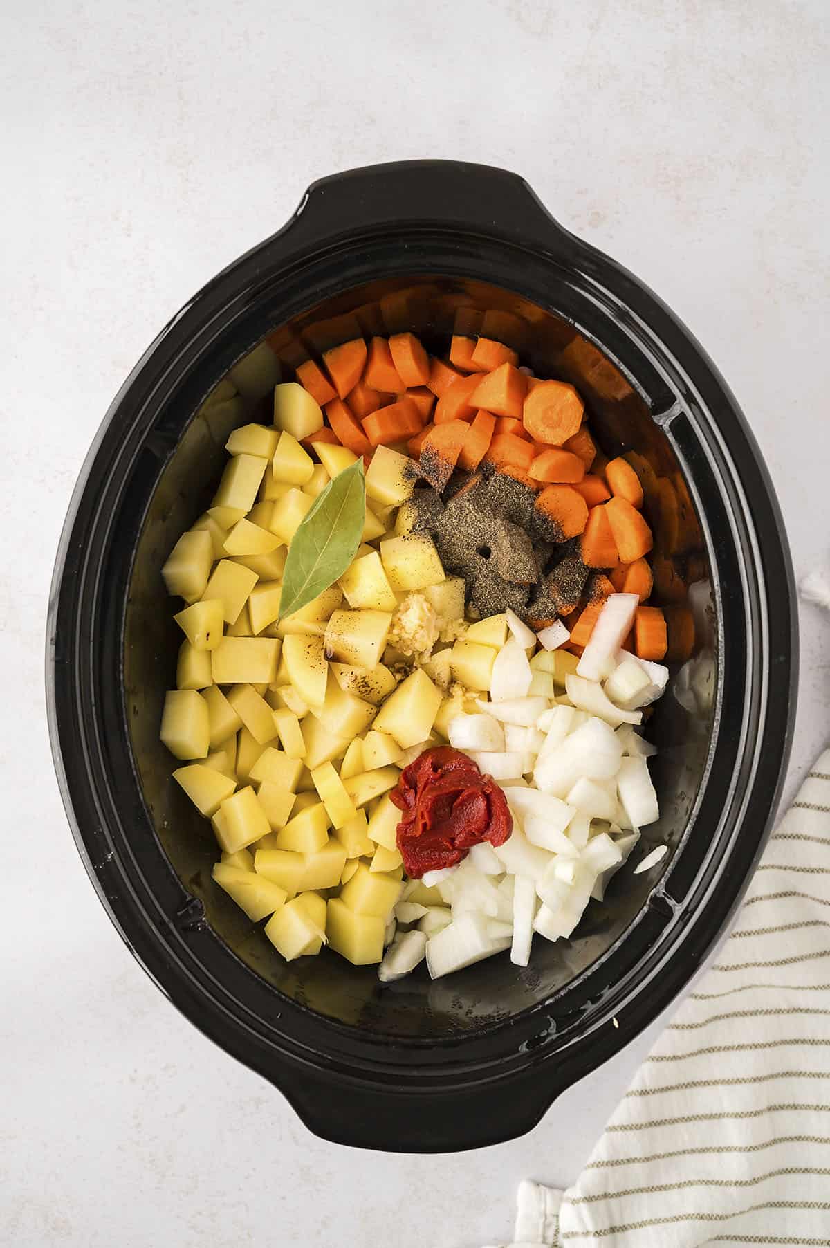 Ingredients for beef stew in slow cooker.