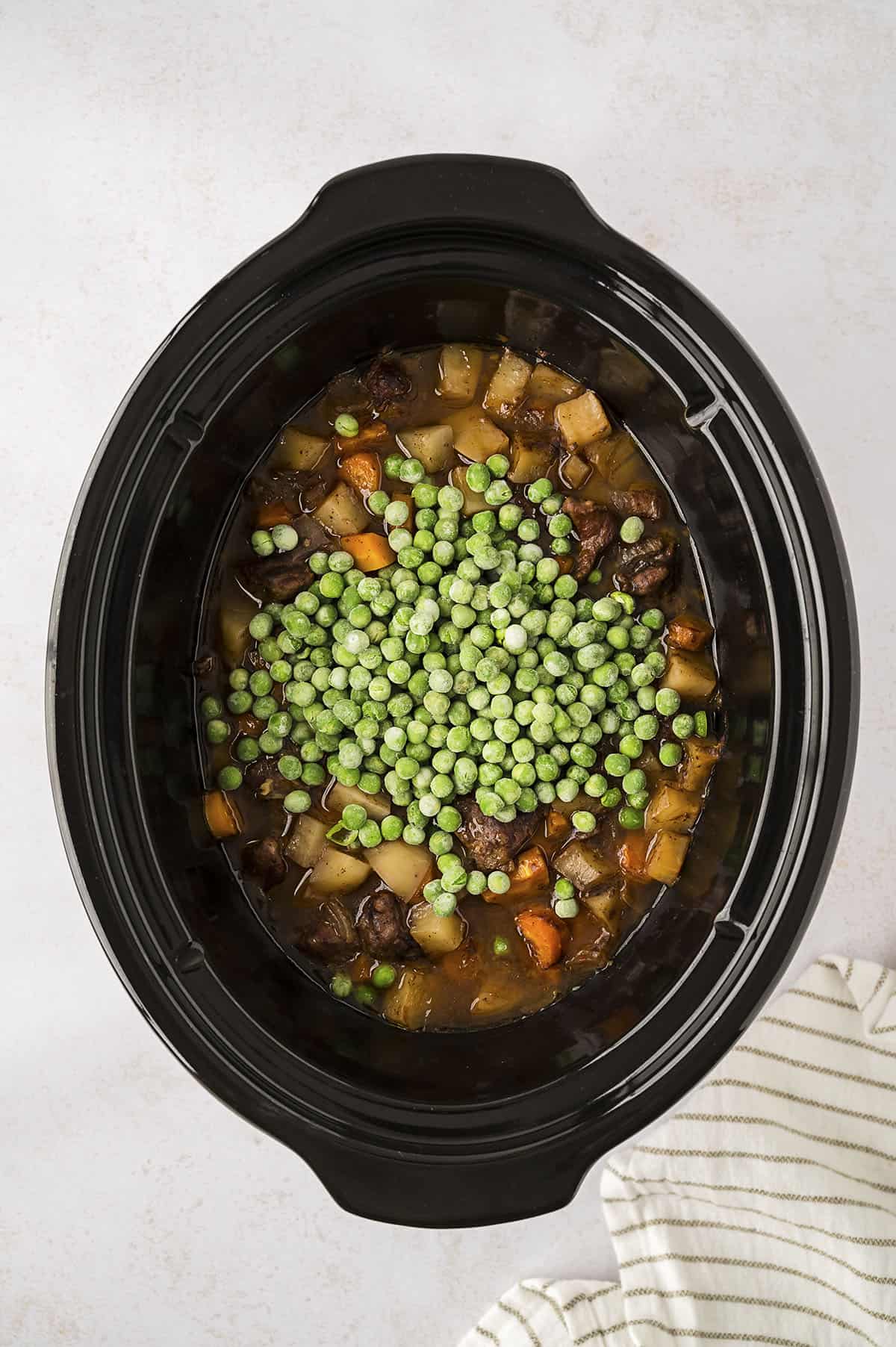 Frozen peas added to beef stew.