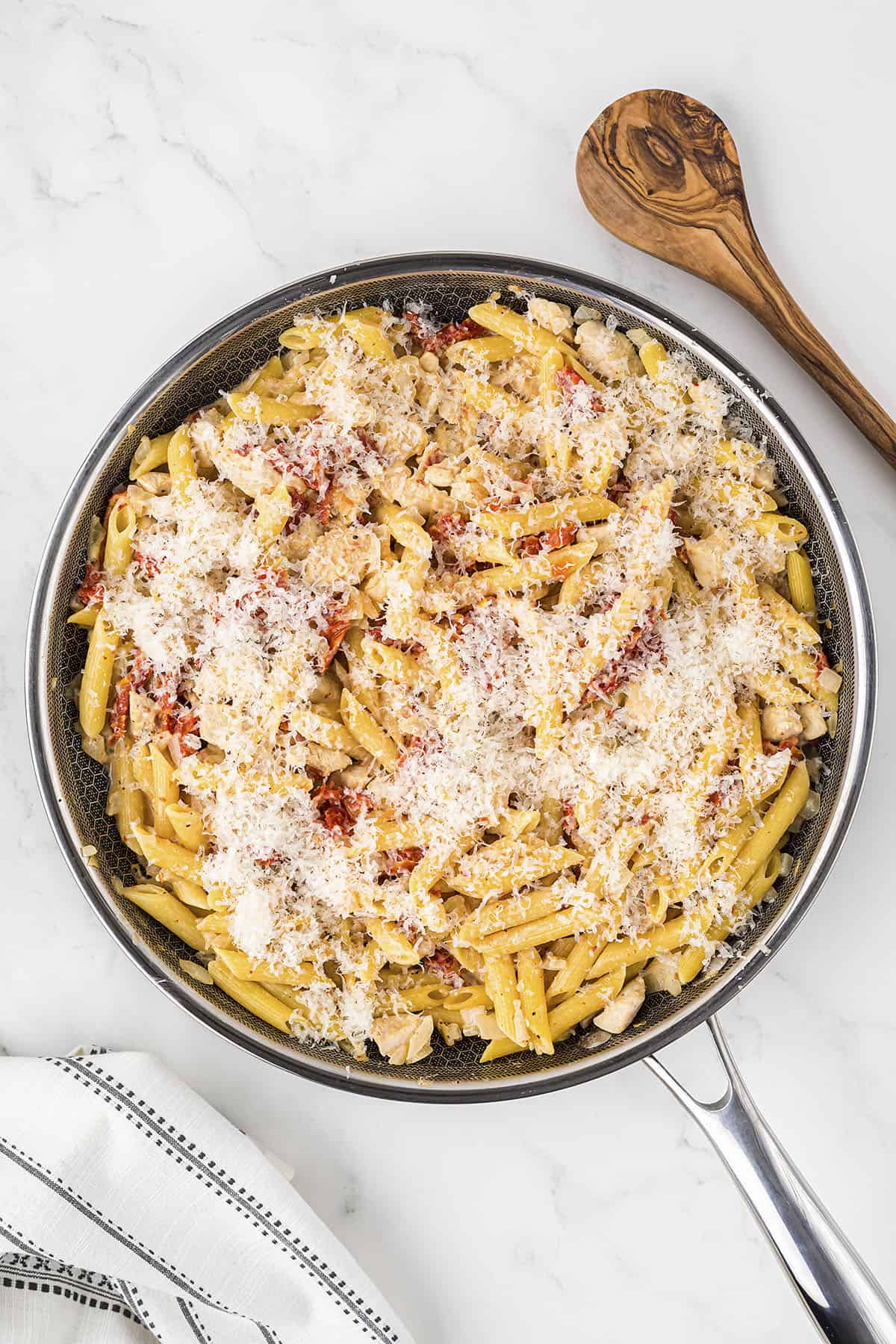 Parmesan cheese sprinkled over pasta.