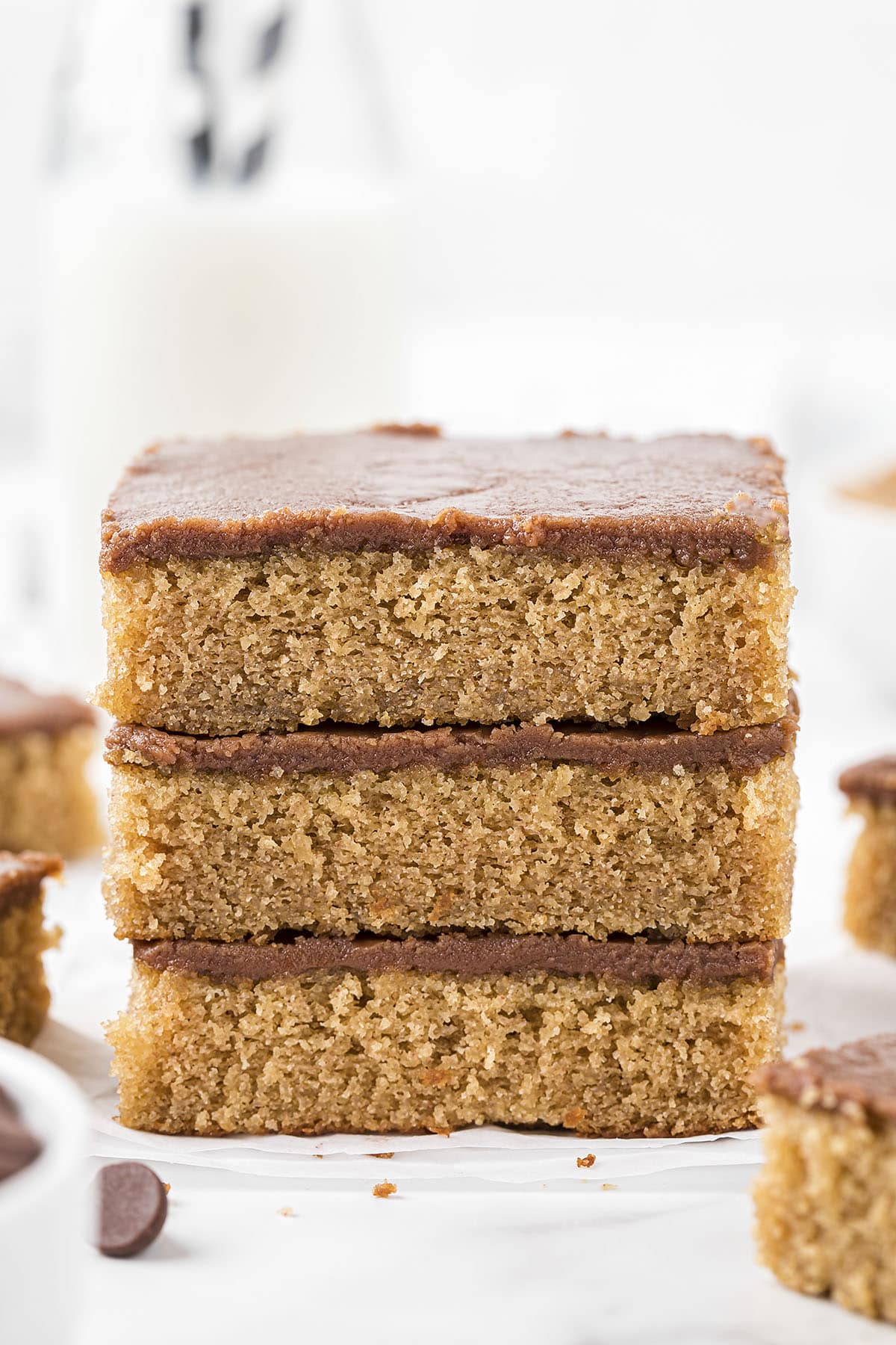 Peanut butter sheet cake stacked on counter.