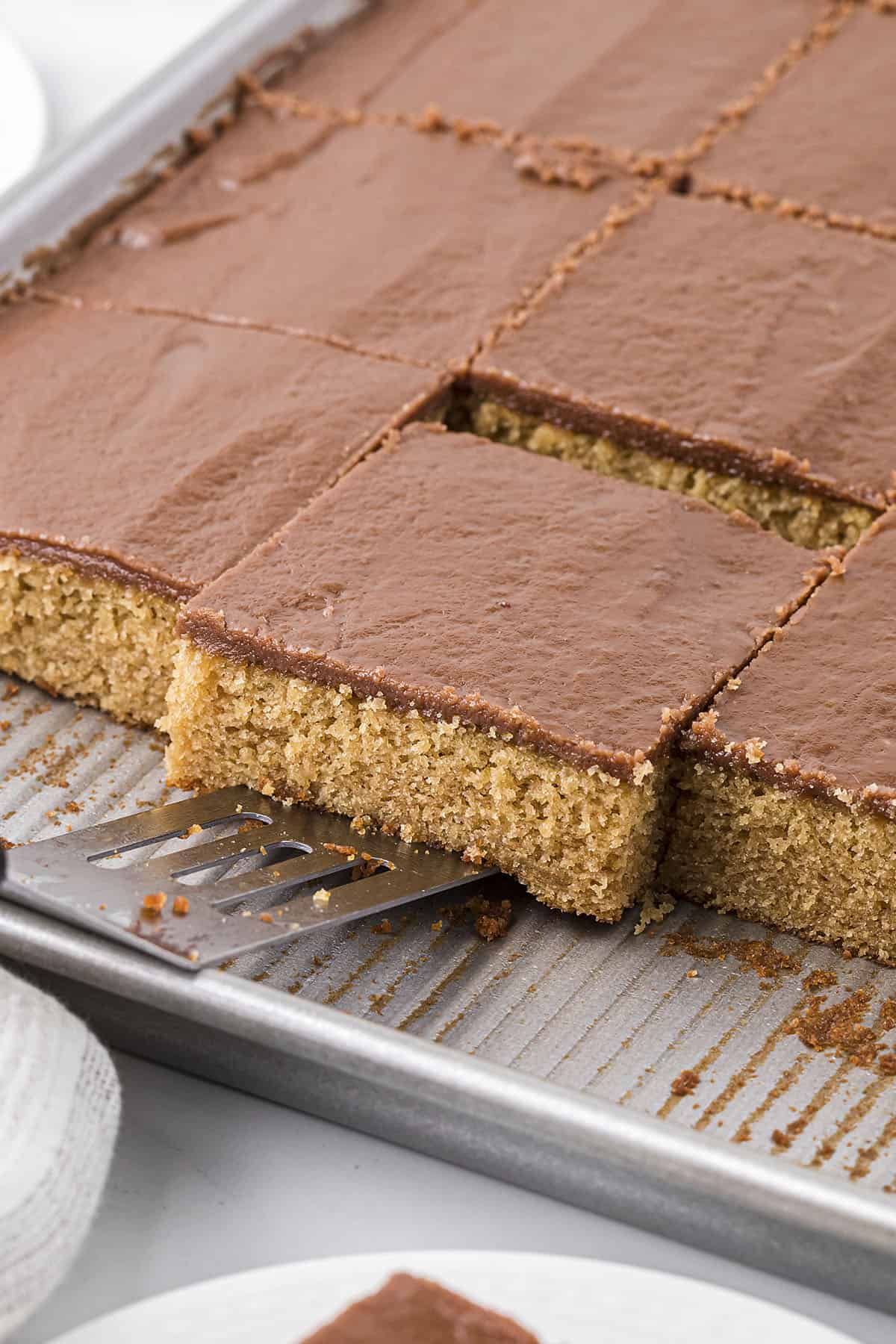 Peanut butter sheet cake on spatula.