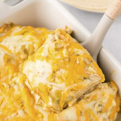 Baked chicken enchilada casserole recipe in pan.