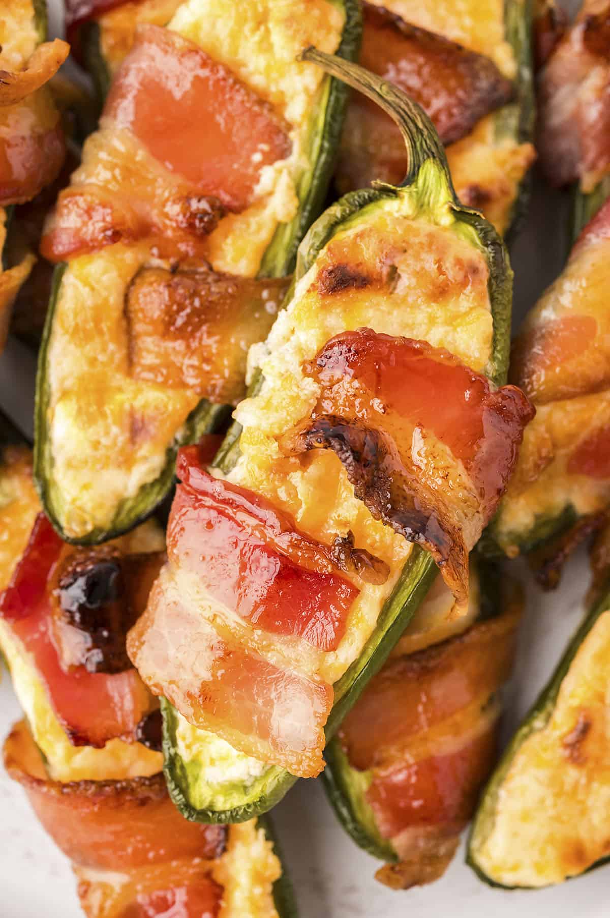 Close up of bacon wrapped jalapeno poppers.