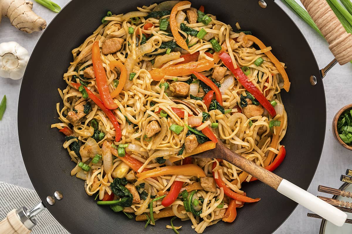 Pork lo mein in wok.