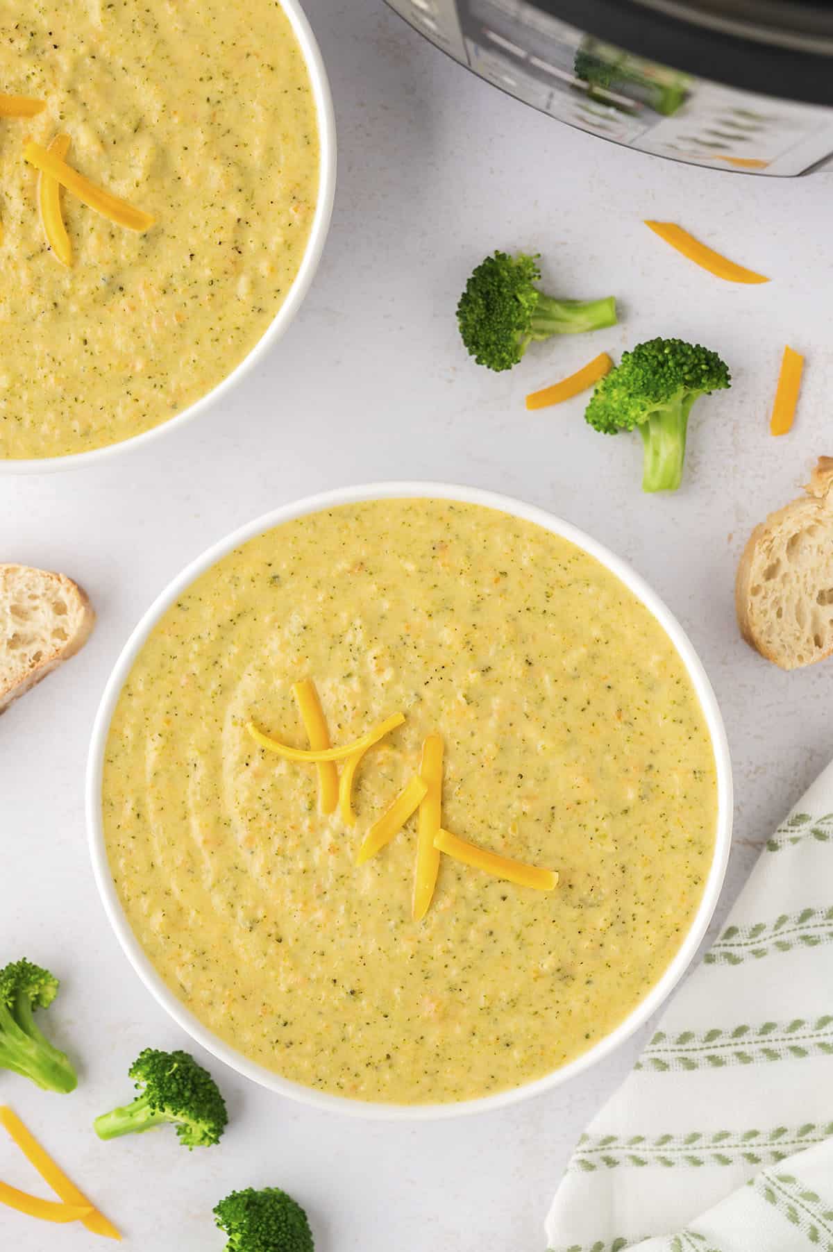 Bowl full of broccoli cheddar soup.