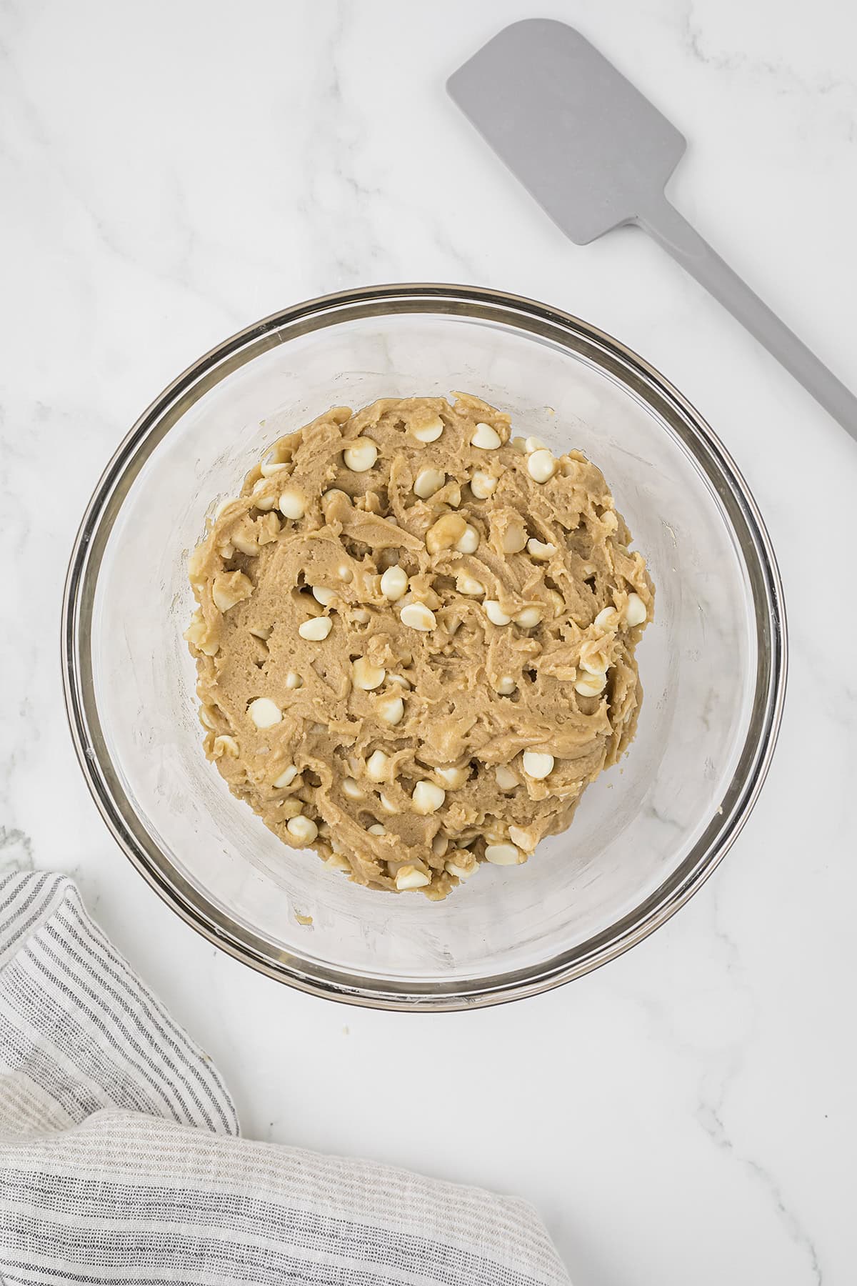 White chocolate and macadamia nuts stirred into cookie dough.